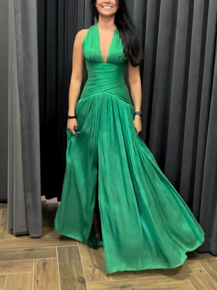 Emerald green plunging neckline gown with pleated skirt and side slit, by The Fashion Celestial, shown from front view.