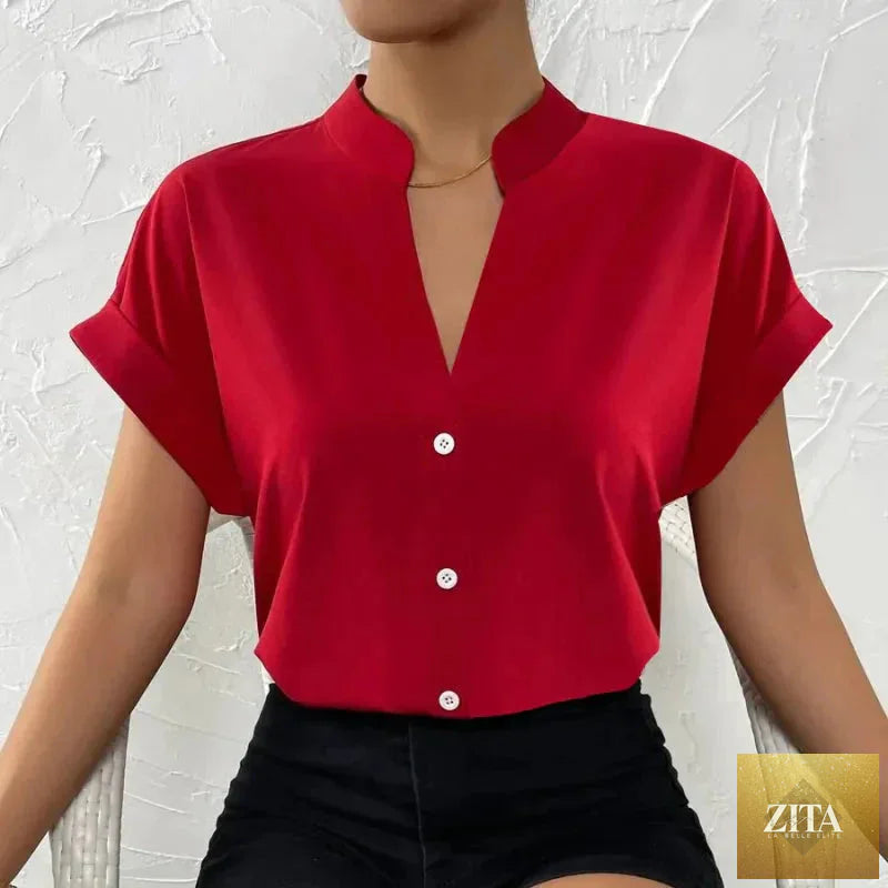 Light orange satin V-neck short sleeve shirt for women by FitiqueFit, showcasing smooth fabric and elegant casual style.