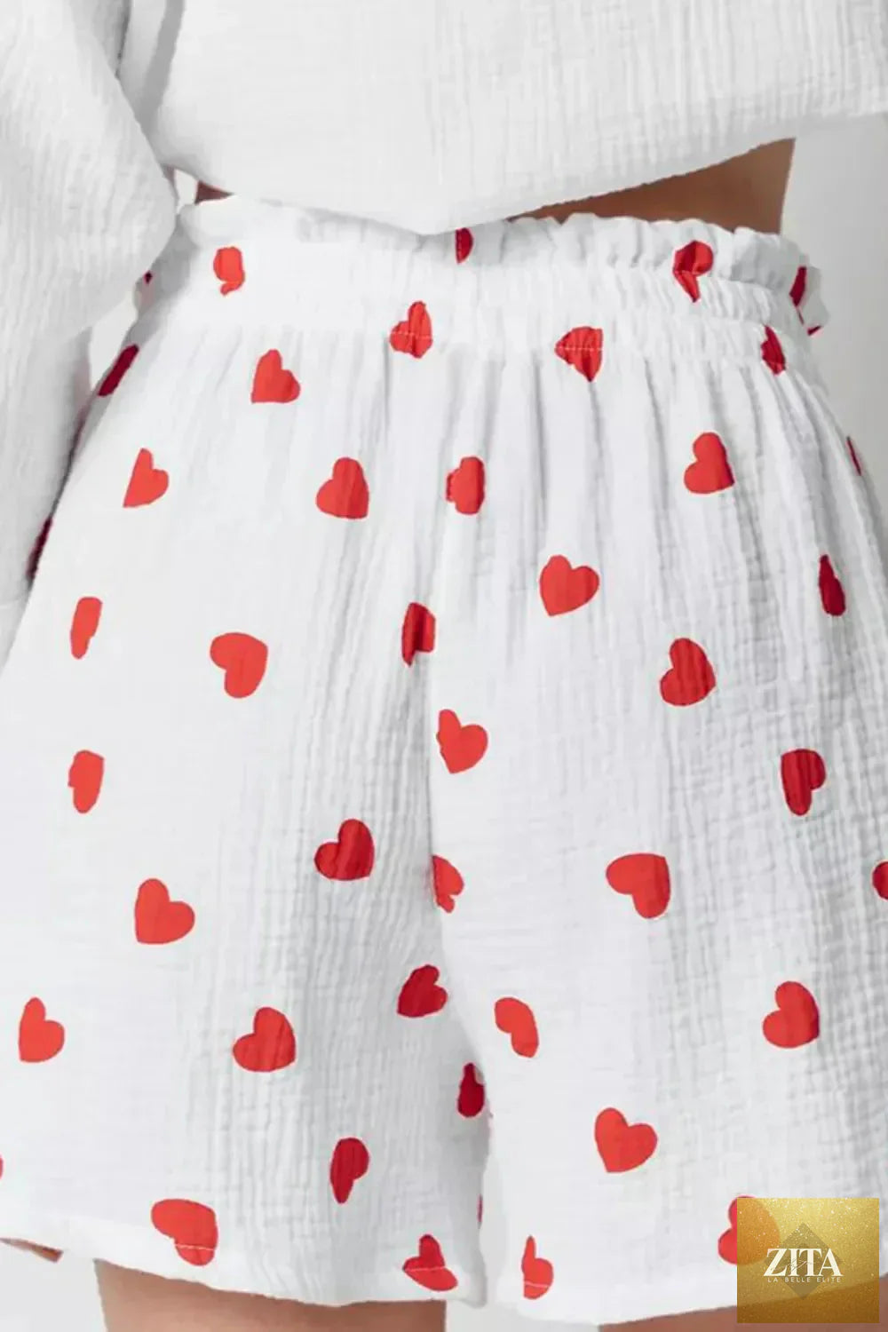 Basic Bae heart collared neck button down top and shorts set, featuring a stylish, casual look with a heart detail on the collar.