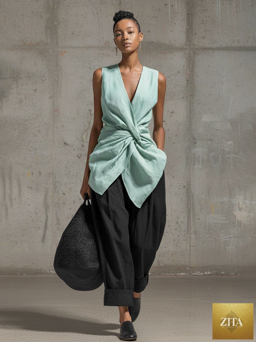 Women's casualwear set featuring a tie-front V-neck sleeveless top and wide-leg pants from FitiqueFit, shown on a model.