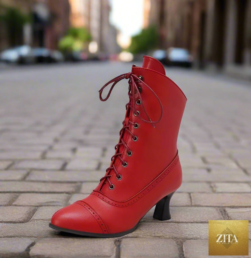 Women’s high heel Martin boots by Zita La Belle Elite featuring British motorcycle style footwear with buckles and sleek black leather.