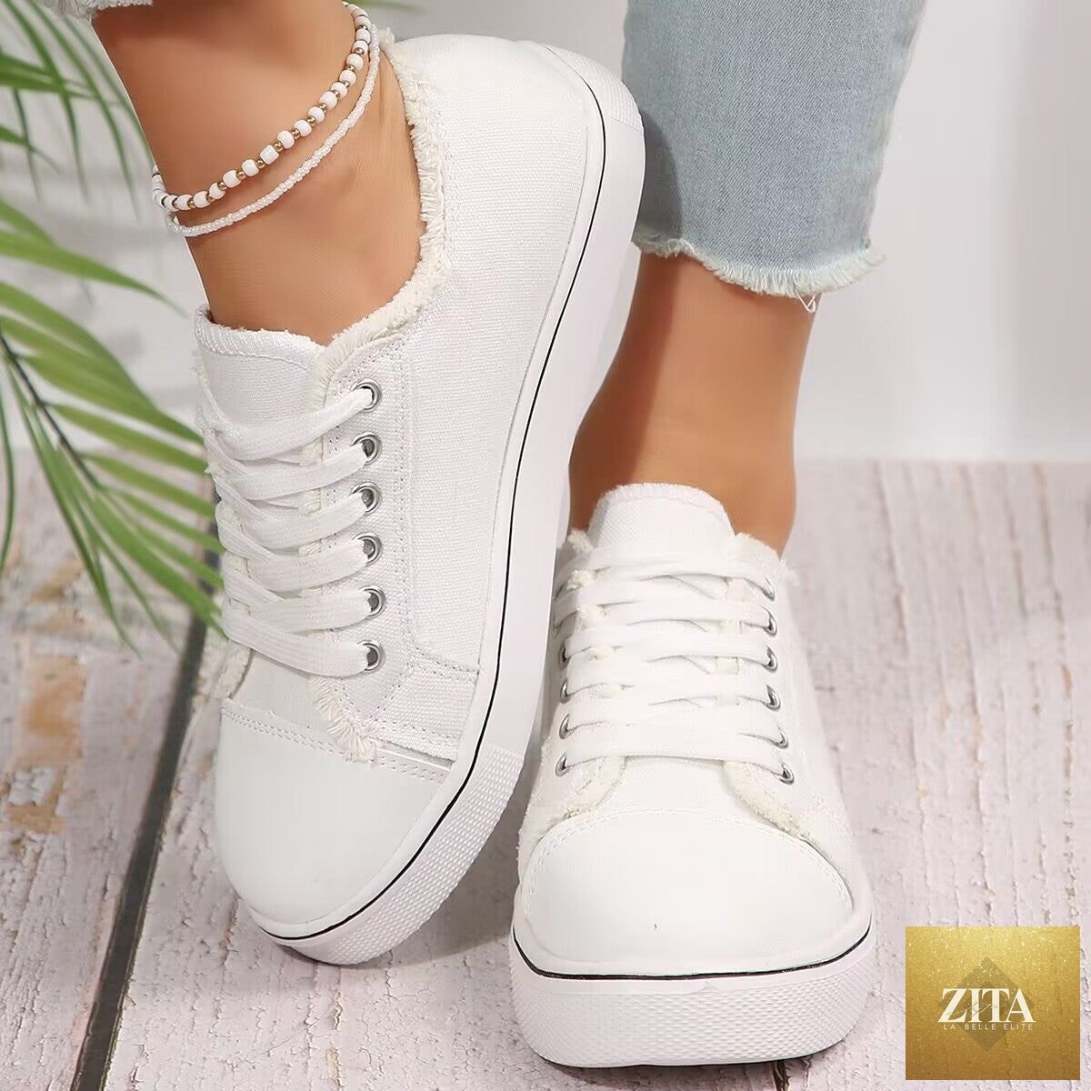 Women's lightweight FitiqueFit canvas sneakers with lace-up design, flat low-top style, perfect for casual wear.
