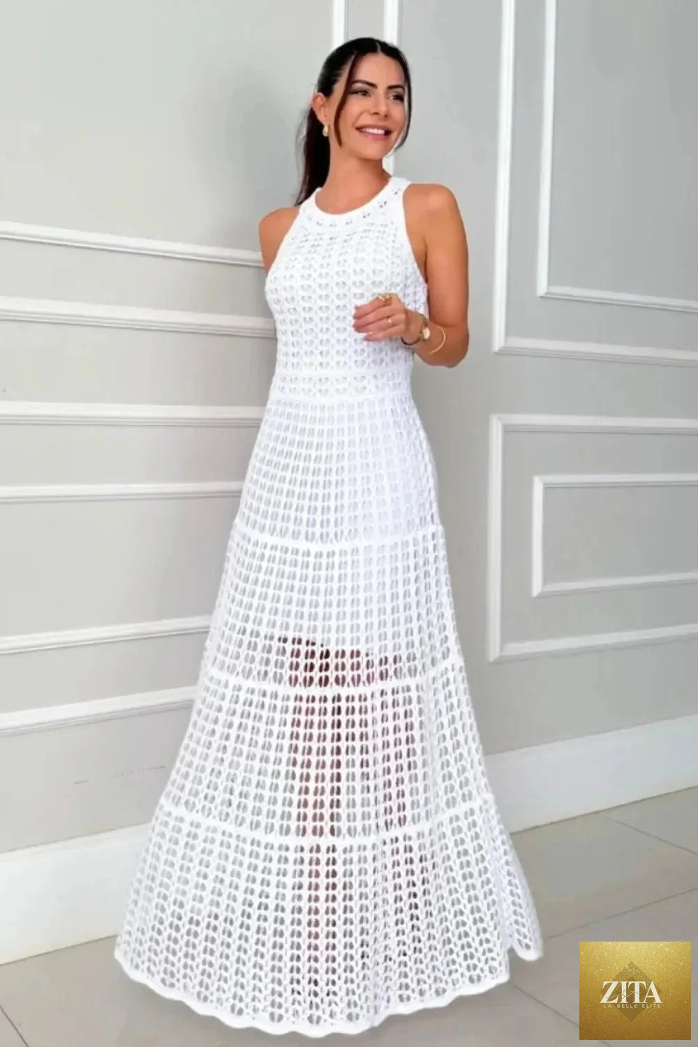 Hollowed-out sleeveless maxi dress from Shopiebay featuring a flowy silhouette and stylish cut-out details.