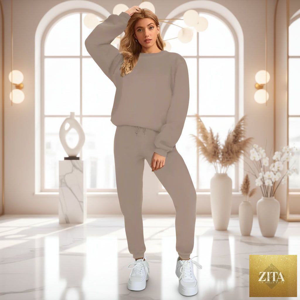 Women's oversized drop-shoulder sweatshirt and jogger pants sweatsuit set by MERIDGE, featuring a cozy, relaxed fit in soft fabric.