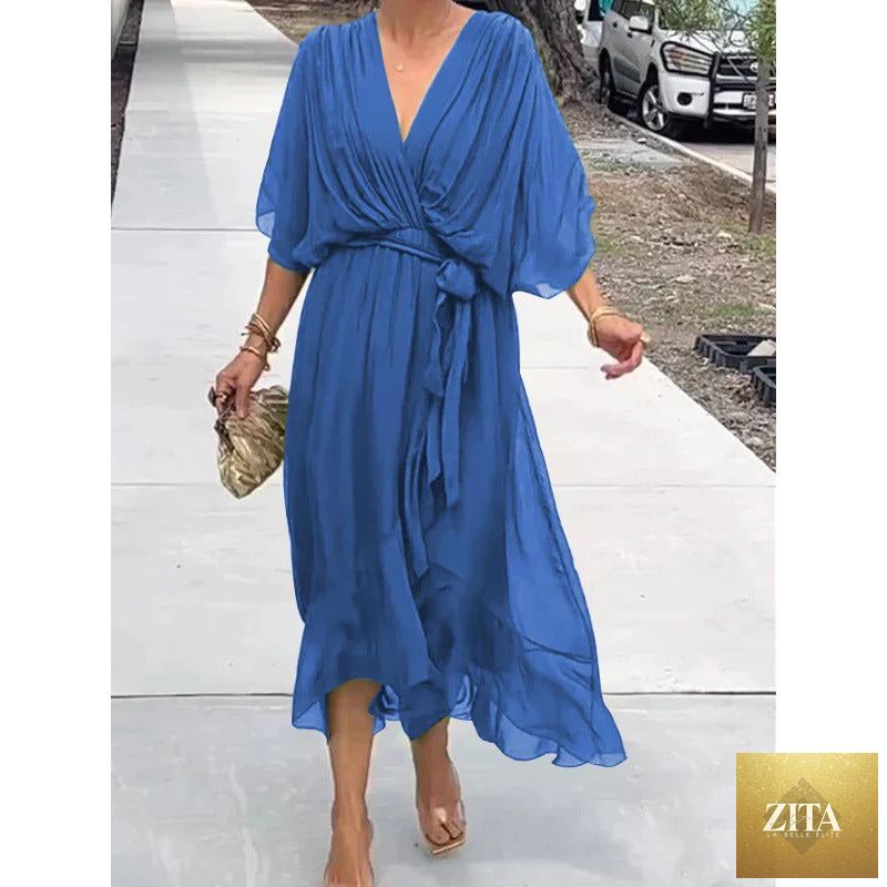 FitiqueFit Batwing Sleeve V-Neck Midi Dress with tied irregular hem, flowing fairy dress style, black fabric, elegant and stylish.