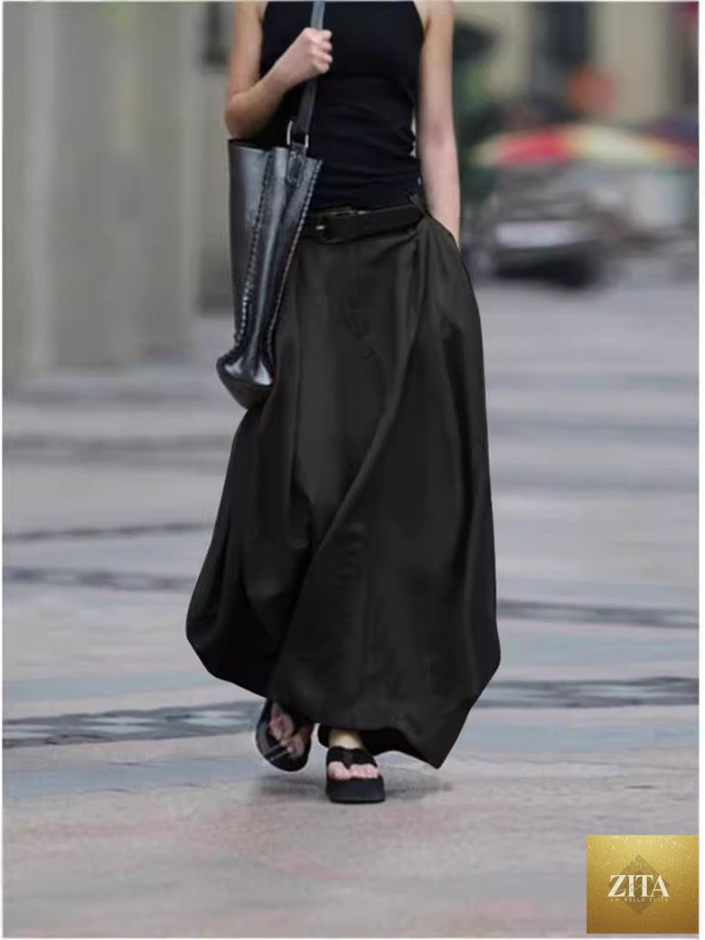 Women's high-waist flared maxi skirt in solid cotton linen with pockets, from FitiqueFit, featuring a flowy silhouette and stylish design.
