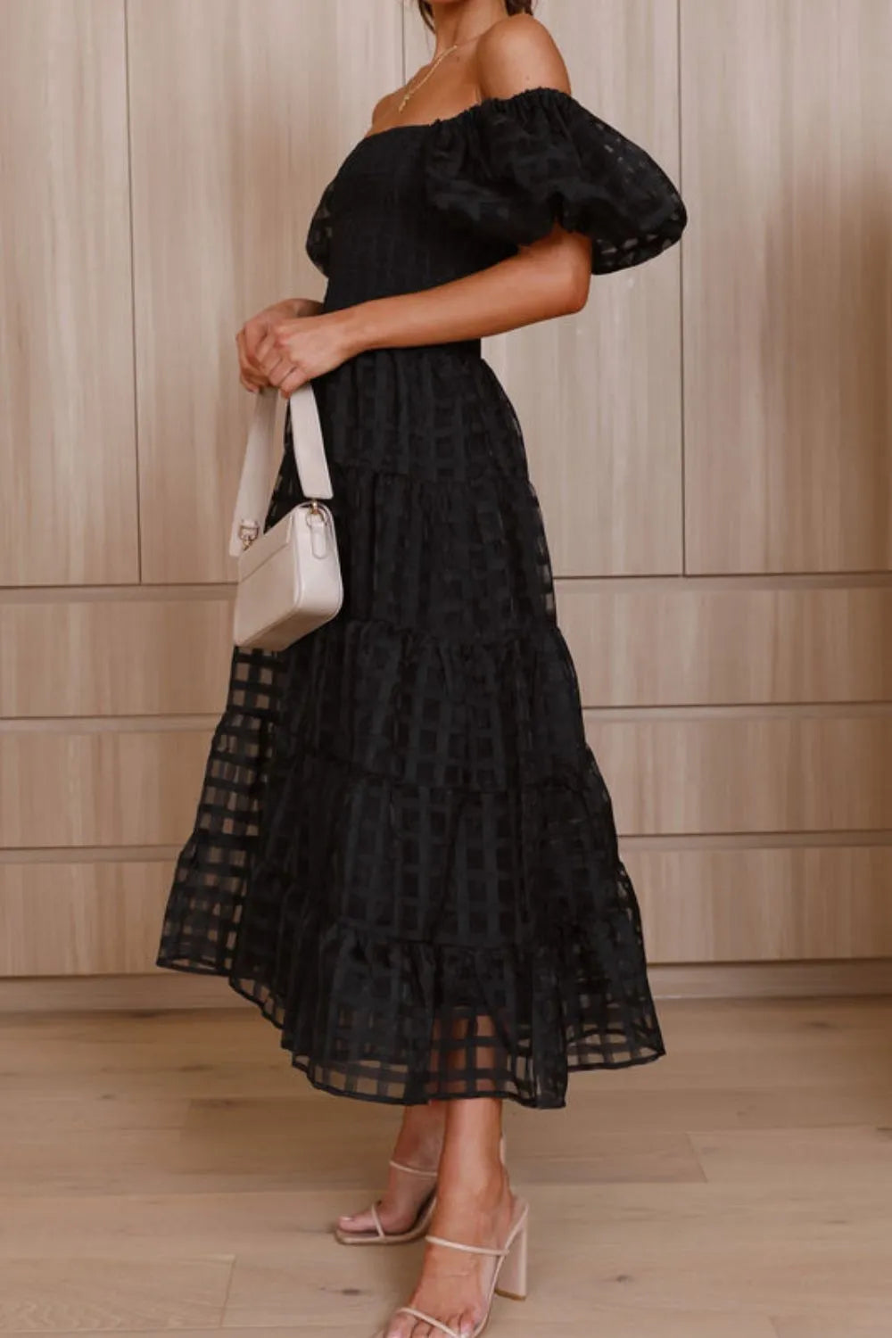 Off shoulder short puff sleeve midi dress from Shopiebay, featuring a fitted bodice and flowy skirt in a stylish design.