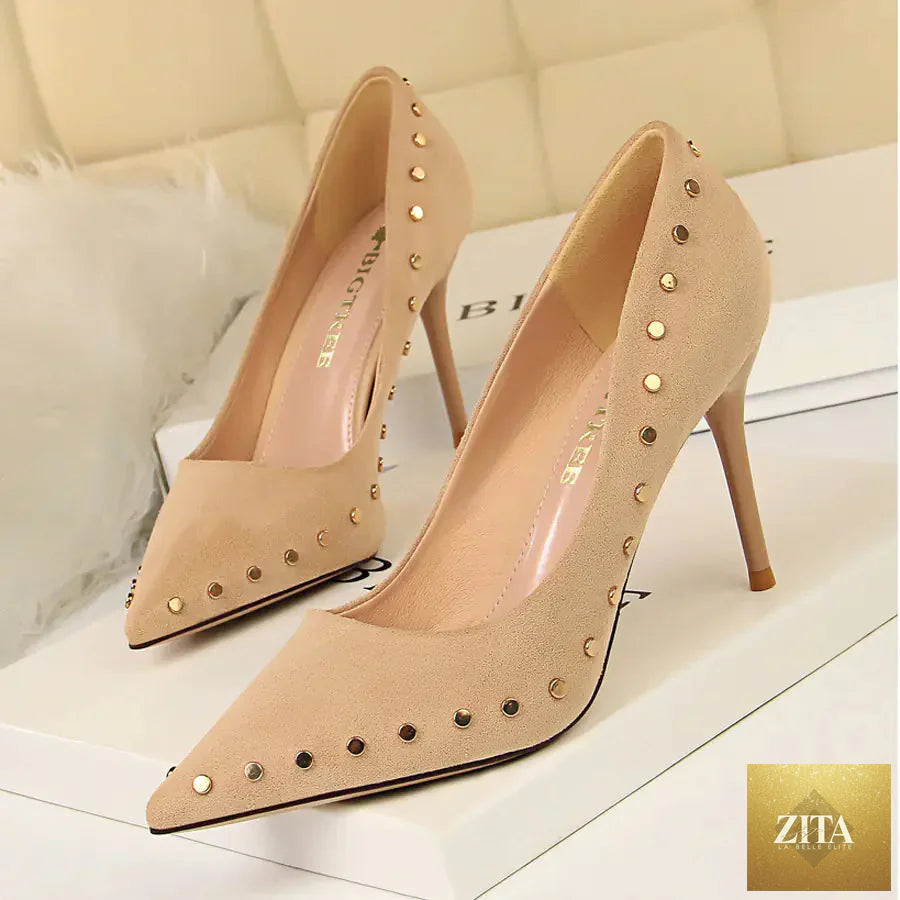 Vintage women's high heels with pointed toes and studded accents, stylish women's shoes in a classic design.