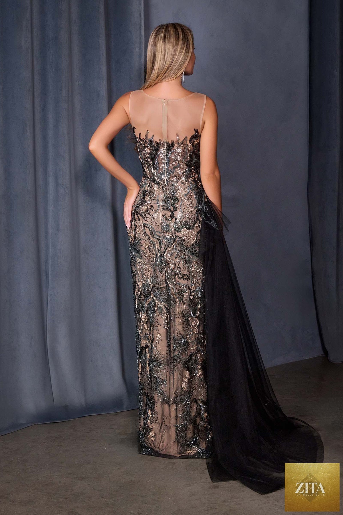 Black Andrea & Leo A1489 fitted formal gown with sequin embroidery over nude mesh, shown from the back.