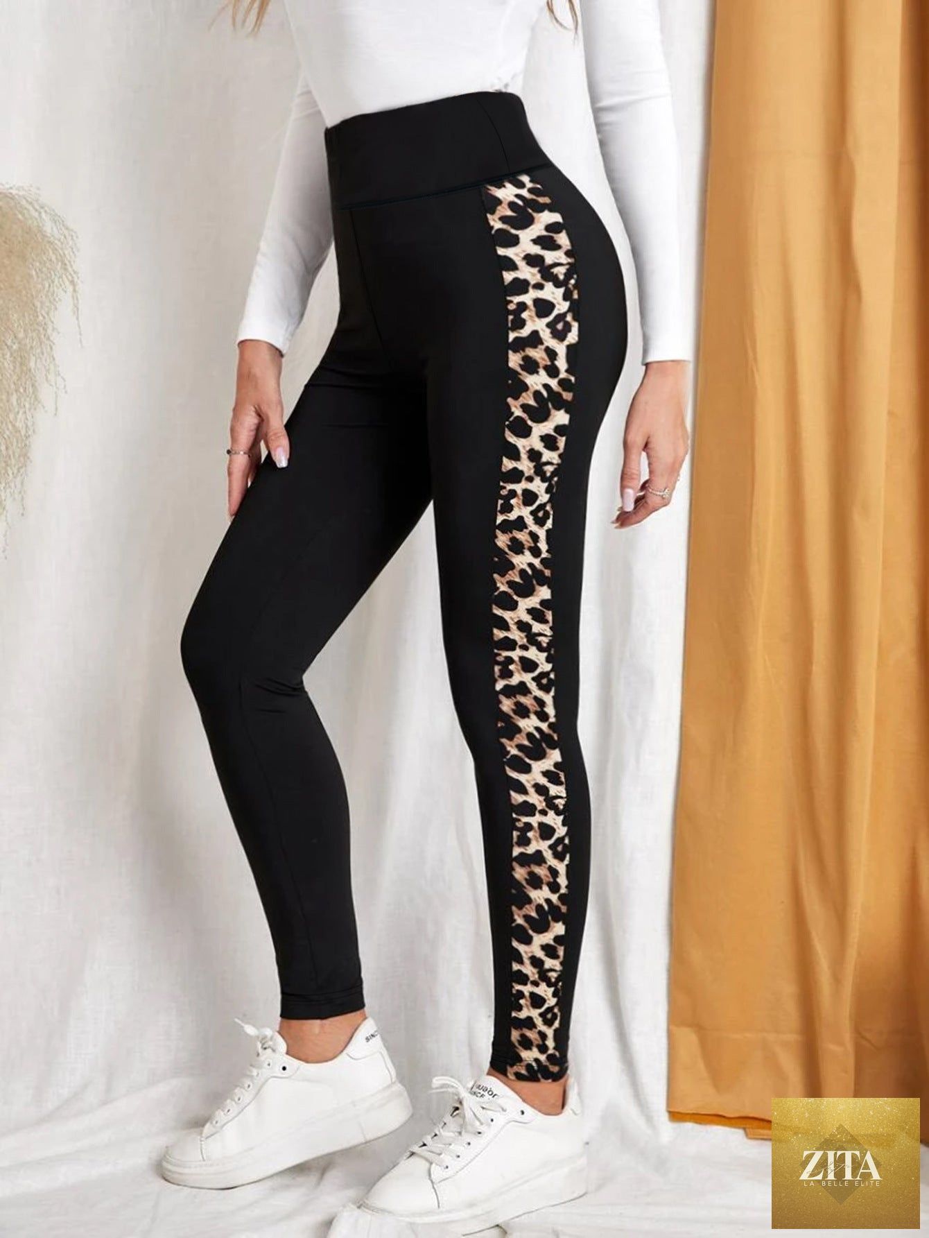Leopard print high-waist yoga leggings by FitiqueFit, stretchy slim fit leggings with butt-lifting design, shown on a model.