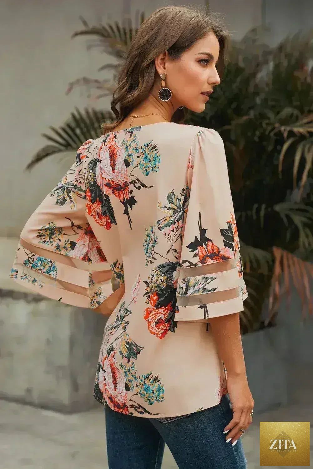 Apricot floral chiffon blouse with 3/4 flared sleeves, stylish and breathable Femstylo top, shown on a hanger.