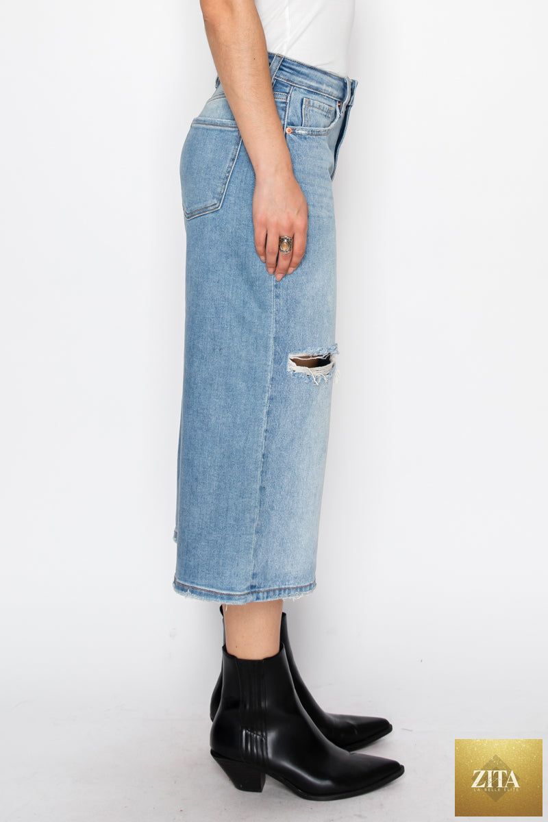 Light blue Artemis Vintage hybrid style ultra high rise relaxed jort jeans displayed on a hanger.
