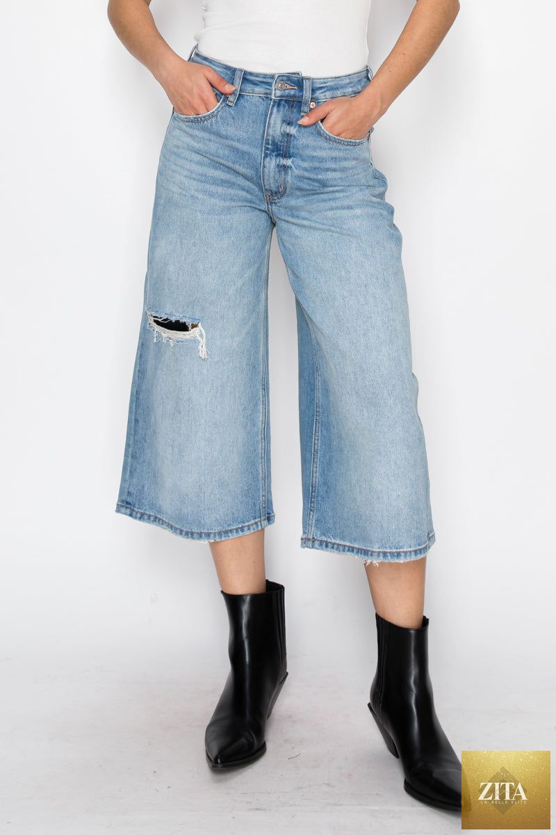 Relaxed fit hybrid style ultra high rise jort jeans by Artemis Vintage, showing distressed denim with a casual, relaxed look.