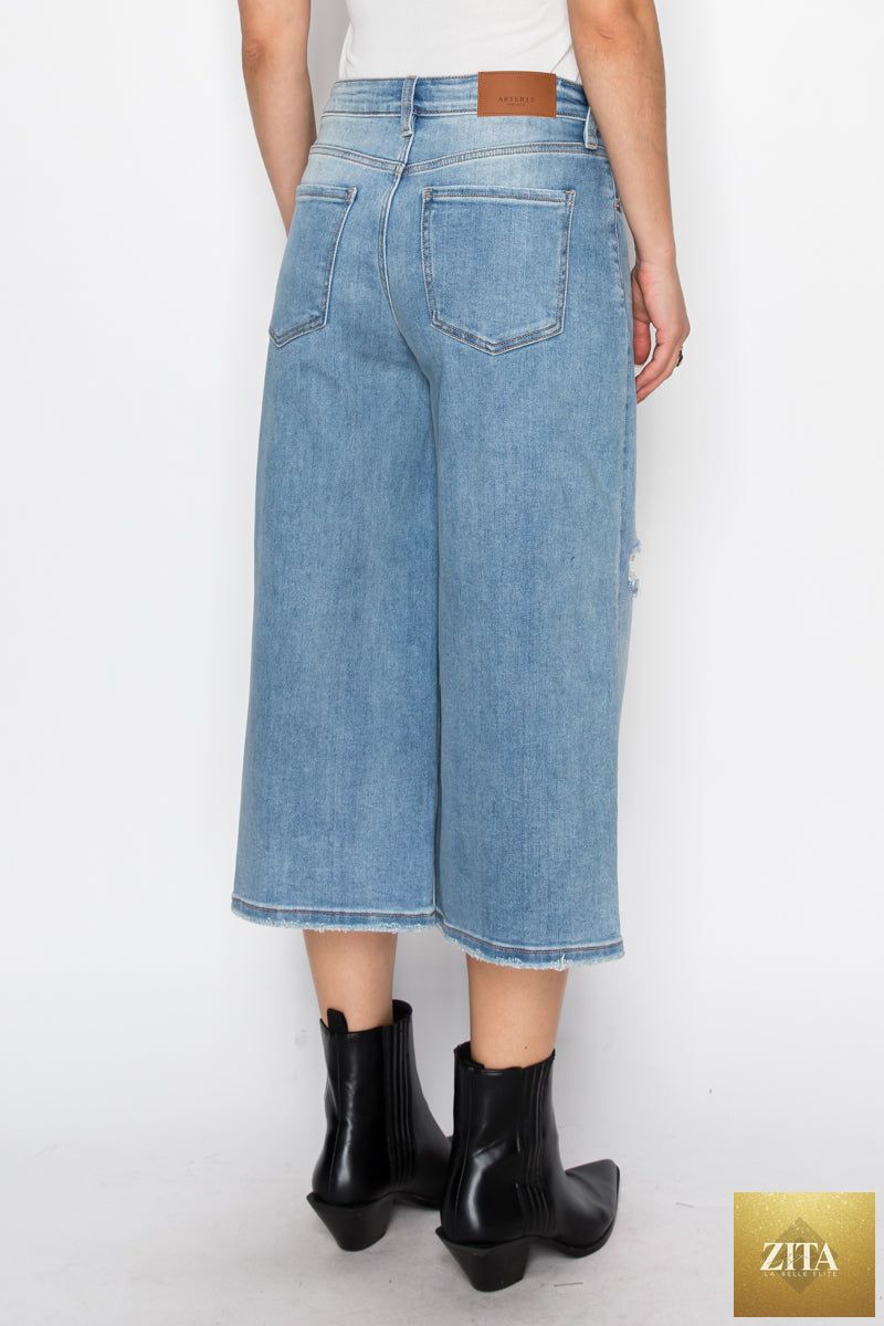 Light blue Artemis Vintage hybrid style ultra high rise relaxed jort jeans displayed on a hanger.