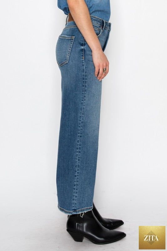 Ultra high rise crop wide jeans by Artemis Vintage, showcasing light wash denim with a relaxed fit and cropped length.