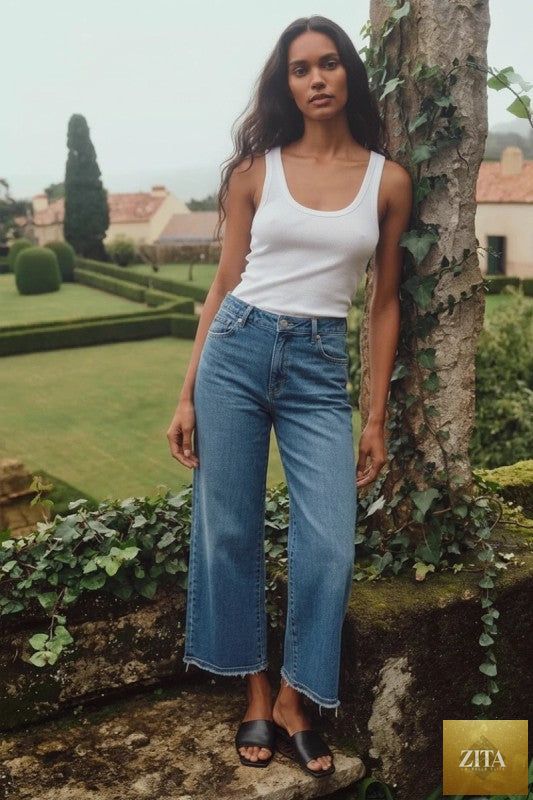 High-rise crop wide jeans by Artemis Vintage featuring a classic denim look and relaxed fit, shown on a model.