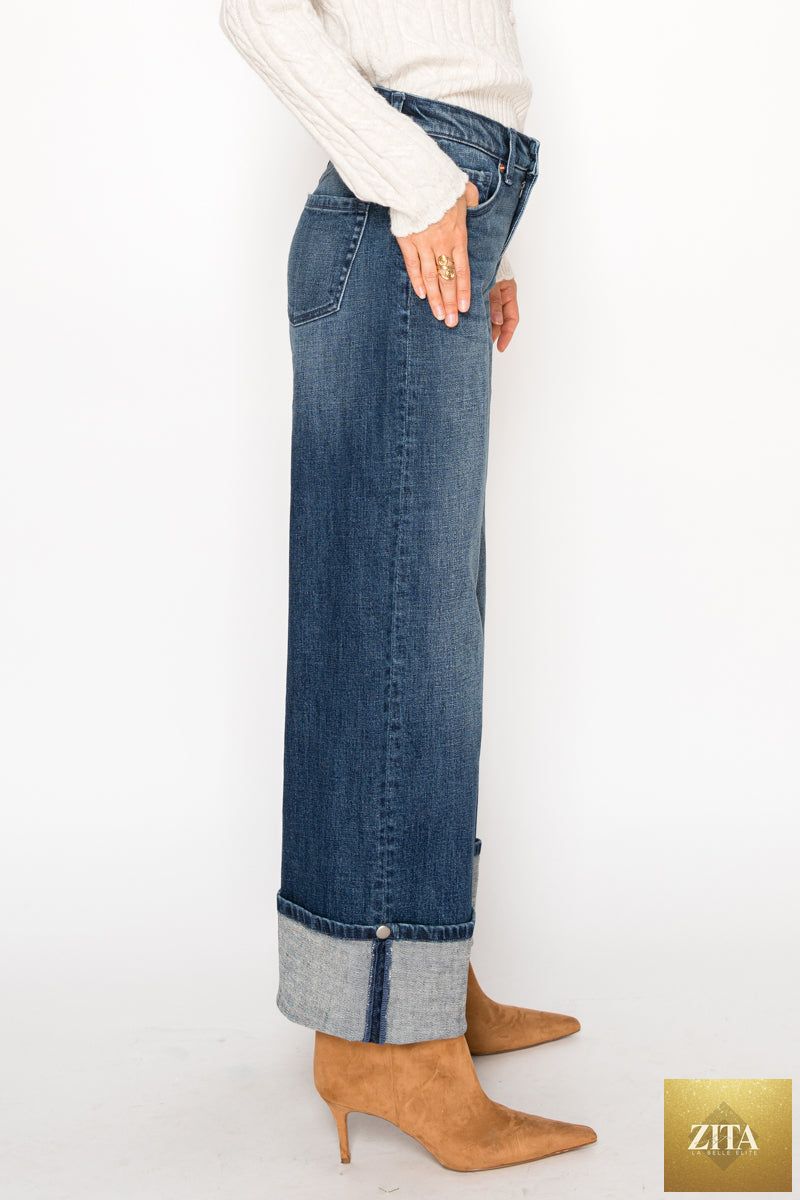 High-rise Artemis Vintage jeans with tummy control and A-wide fit, showcasing denim fabric and stylish waist design.