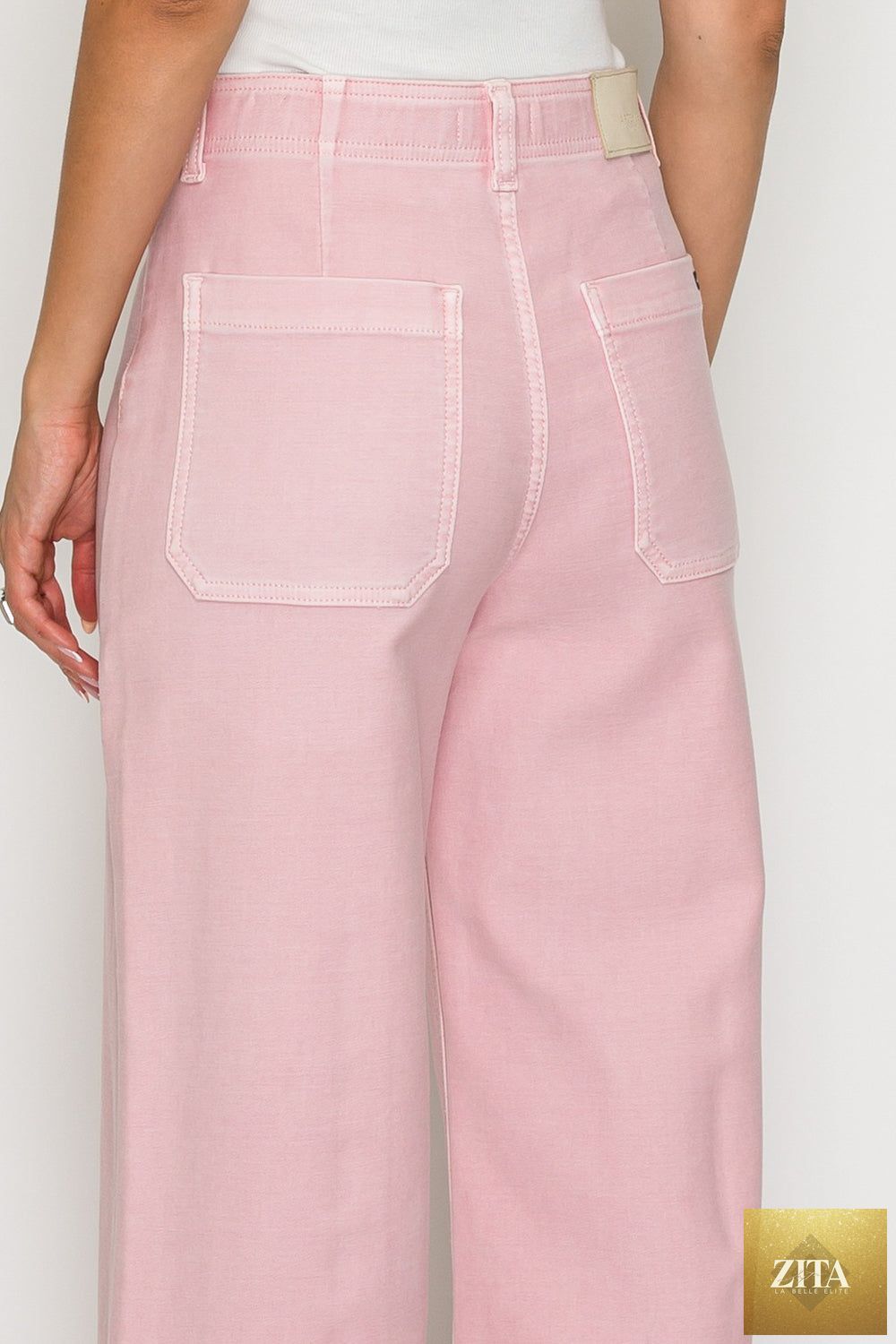 Pair of Artemis Vintage large jeans with tummy control, featuring ultra-high waist and wide-leg fit, shown in natural fabric detail.