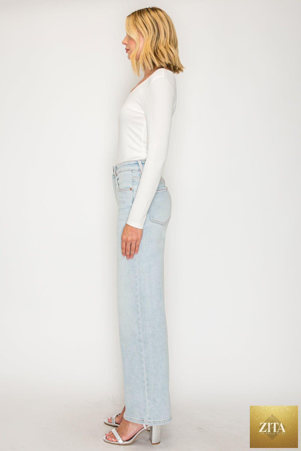 Pink high-rise jeans with tummy control and straight leg fit by Artemis Vintage, made from soft modal fabric.