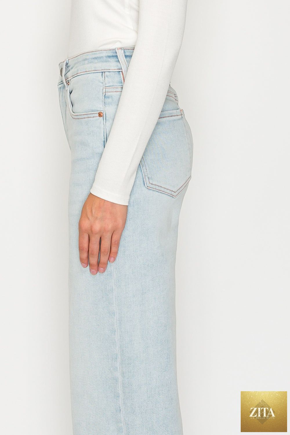 Pink high-rise jeans with tummy control and straight leg fit from Artemis Vintage, made of soft modal fabric with pink thread detailing.