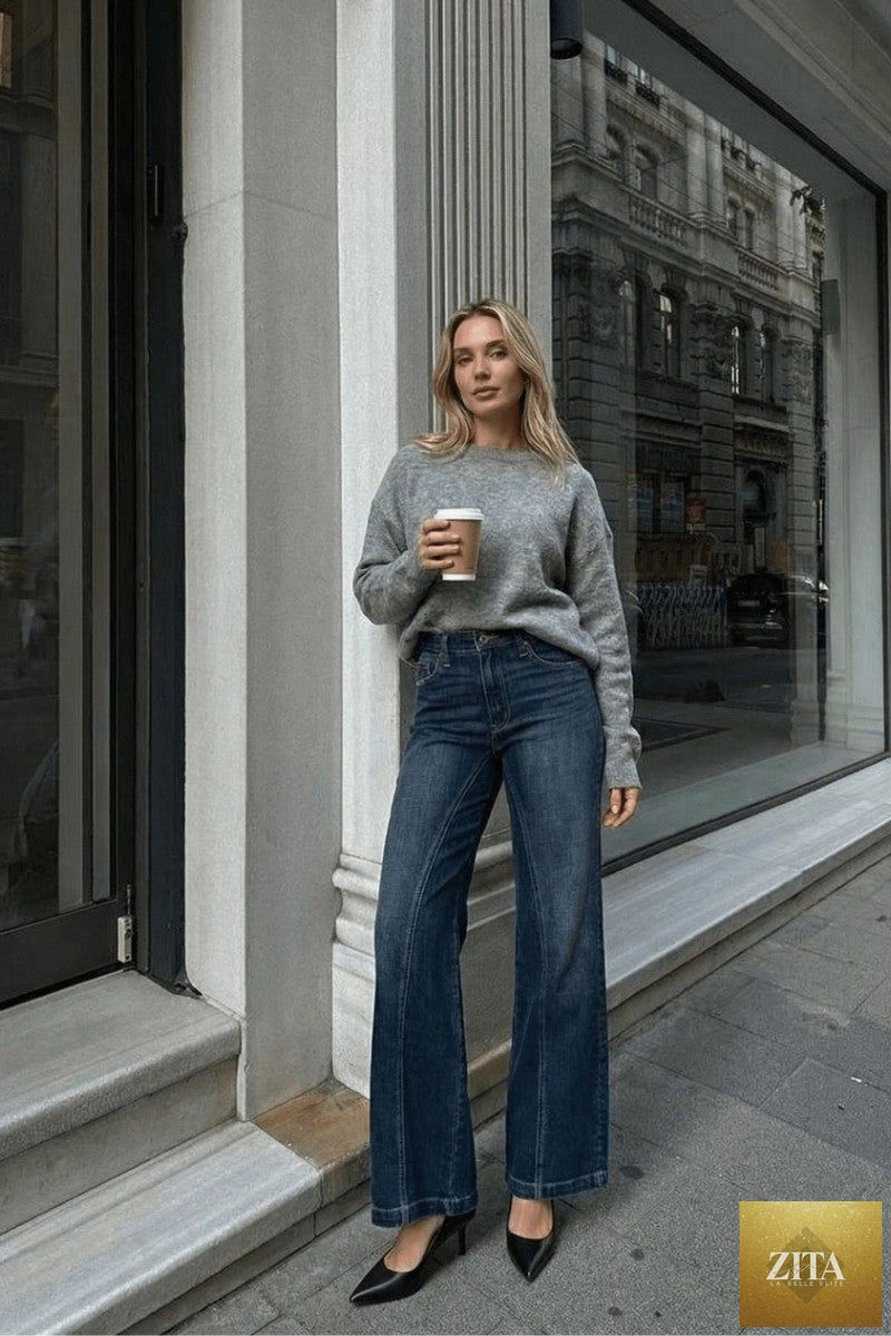 Artemis Vintage hybrid stretch ripped ultra high rise relaxed flare jeans with distressed details and frayed hems.