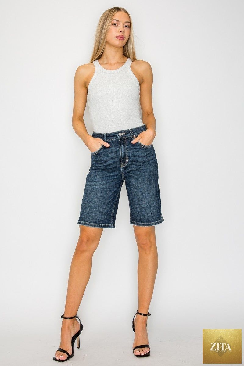 Dark wash high rise Bermuda jeans by Artemis Vintage, showing the knee-length denim with a fitted waist and classic jean styling.