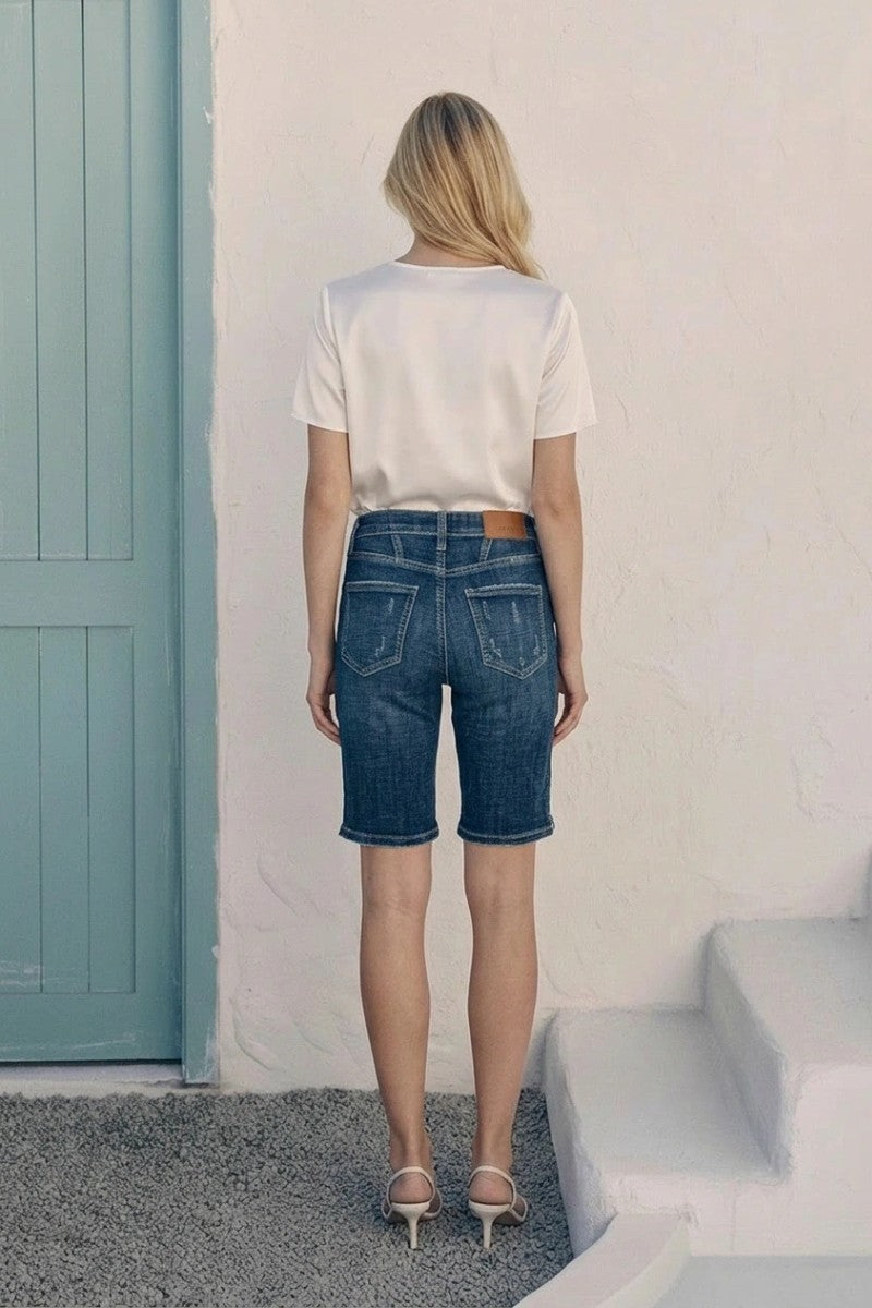 Dark wash Celeste high rise Bermuda jeans by Artemis Vintage, showcasing a relaxed fit and classic denim style.