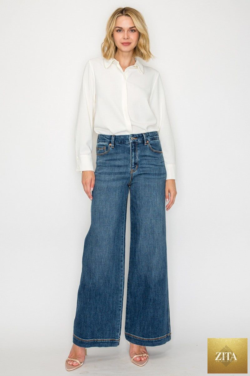 Relaxed high rise palazzo jeans by Artemis Vintage, showcasing classic denim style with wide-leg fit and high waist.