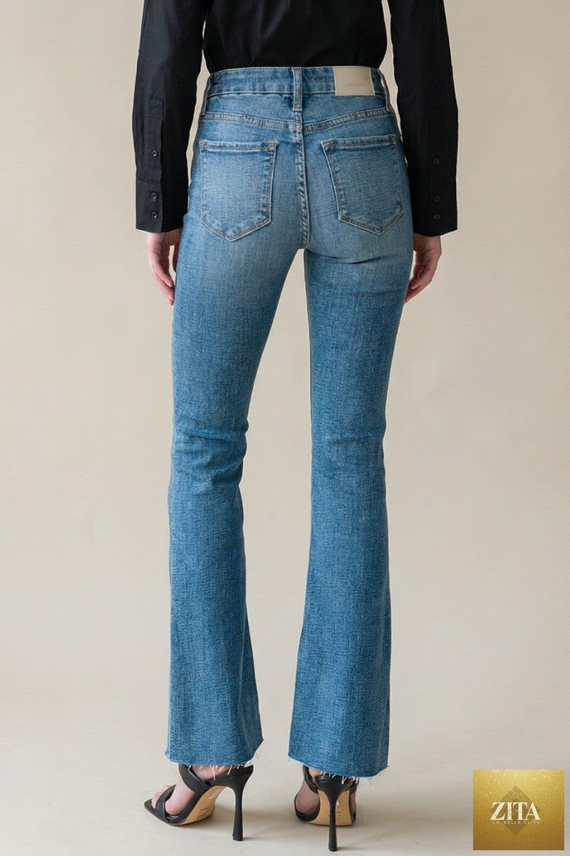 Artemis Vintage paisley high rise flare jeans for women, showing the stylish fit and detailed paisley pattern in a natural pose.