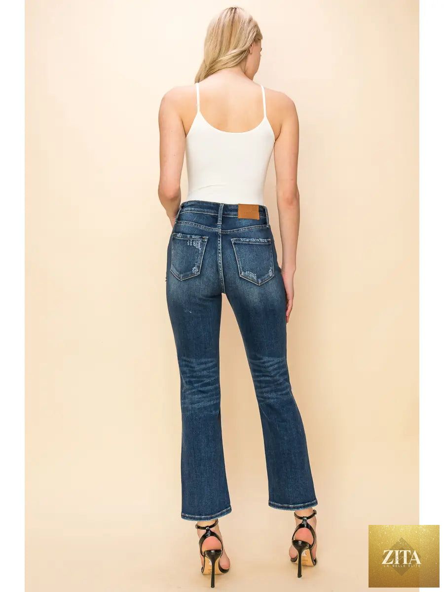 Artemis Vintage distressed high-rise stretch straight jeans with a relaxed fit, showcasing front view and classic denim texture.