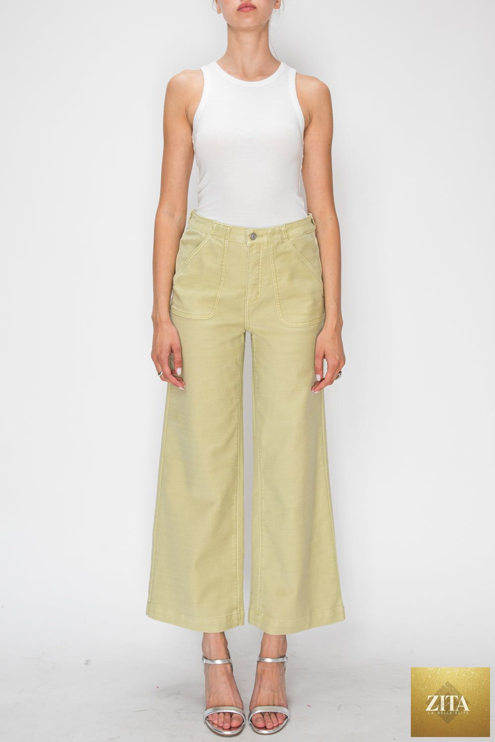 High rise wide leg sage jeans by Artemis Vintage, showing the relaxed fit and high waist style in a denim fabric.