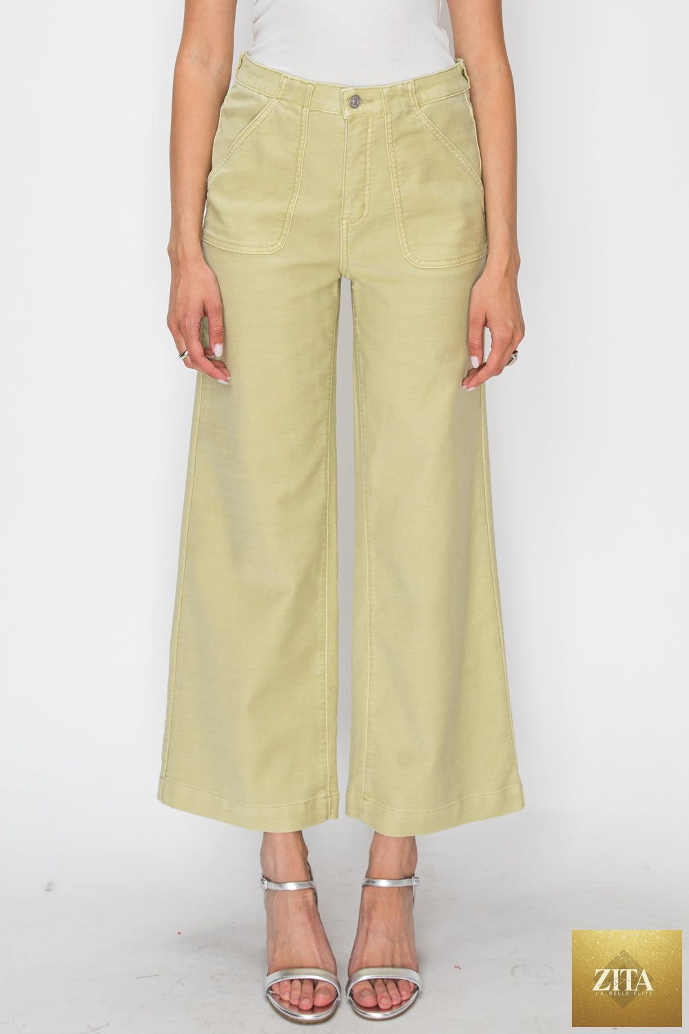 High rise wide-leg sage jeans by Artemis Vintage, showing the relaxed fit and stylish high waist from a front view.