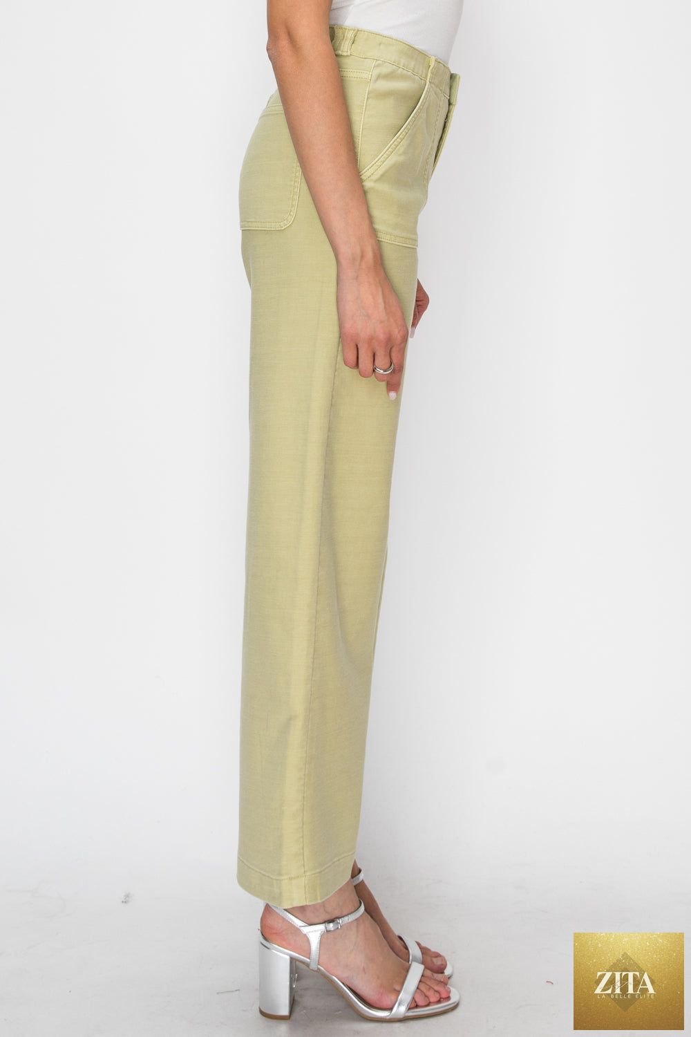 High rise wide leg sage jeans by Artemis Vintage, showcasing the relaxed fit and stylish design.