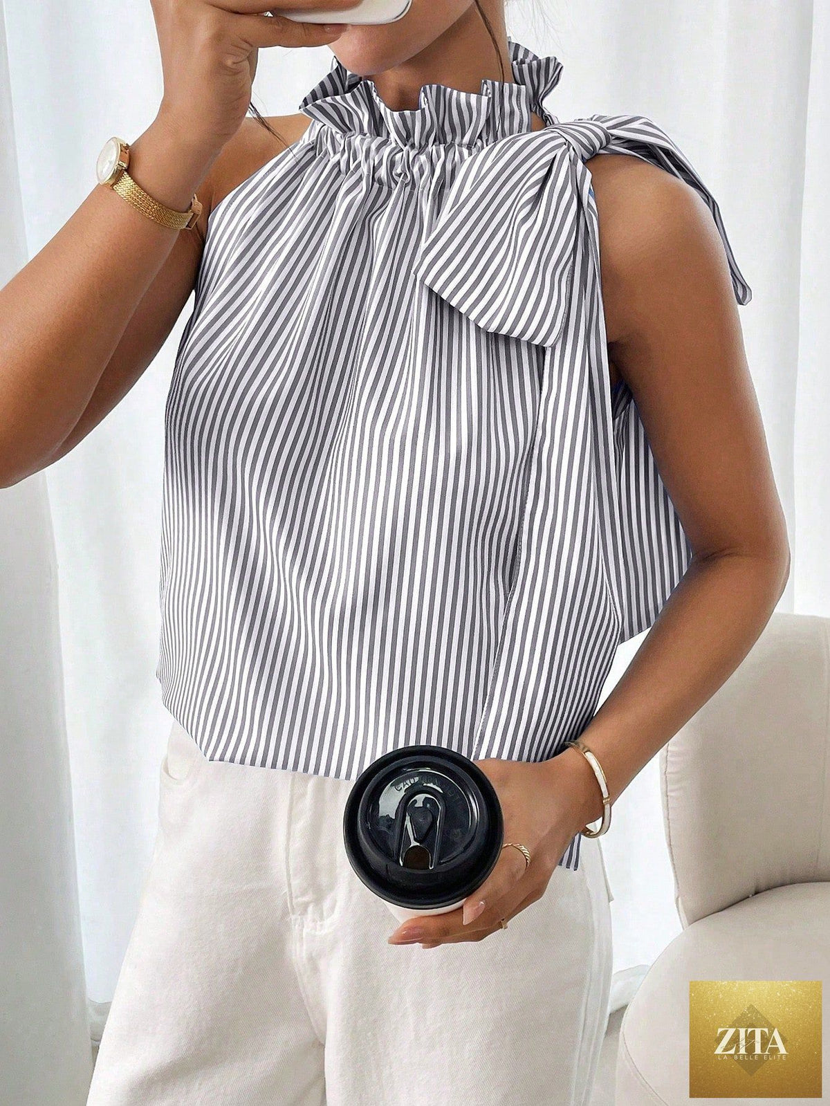 Women's striped sleeveless top by FitiqueFit featuring ruffle high neck, lace trim, tie-knot bow, and stylish blouse details.