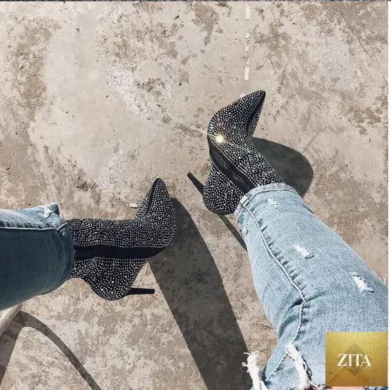 Women’s rhinestone high heel boots with pointed toe from Trendy Attic, featuring sparkling rhinestones and sleek black leather design.