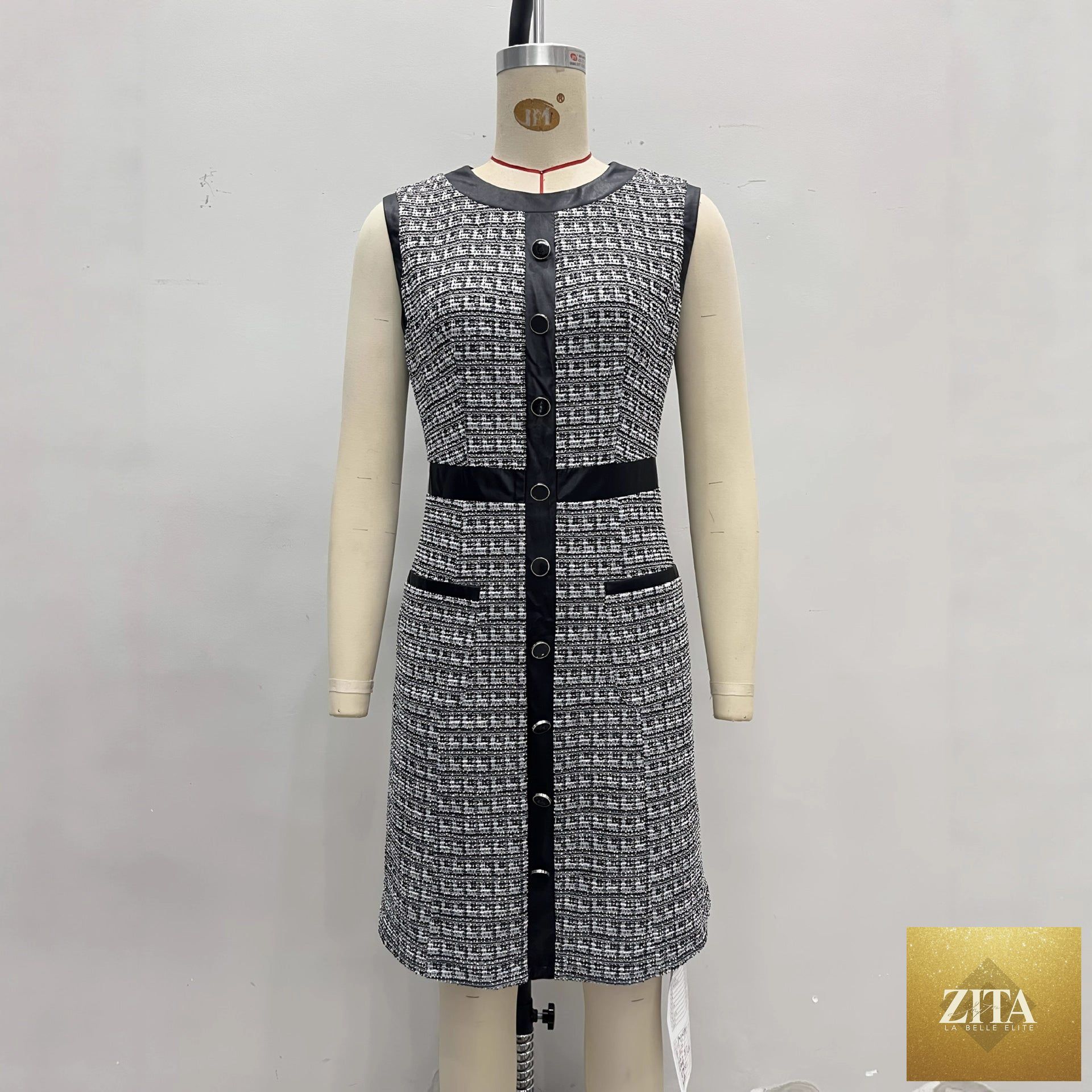 Women's vintage tweed sleeveless A-line mini dress with leather trim vest by FitiqueFit, showcasing classic and stylish design details.