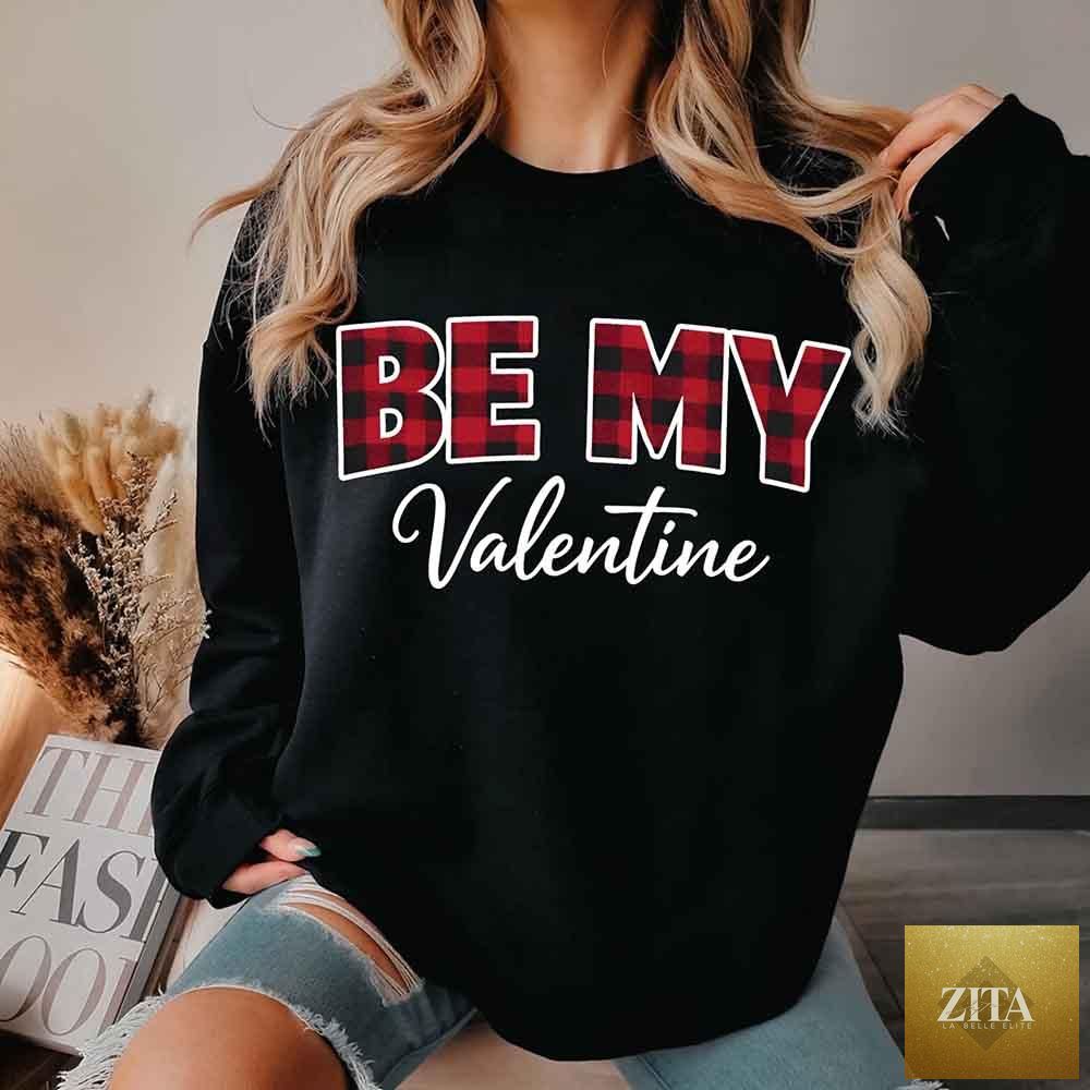 Red and black buffalo plaid crewneck sweatshirt with "Be My Valentine" printed on the front, by Adorb Custom Tees.