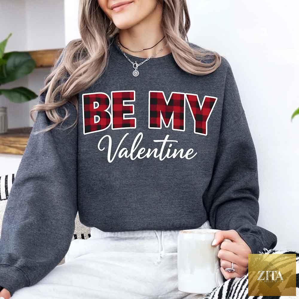 Red and black buffalo plaid crewneck sweatshirt with "Be My Valentine" text, casual Valentine's Day sweatshirt by Adorb Custom Tees.