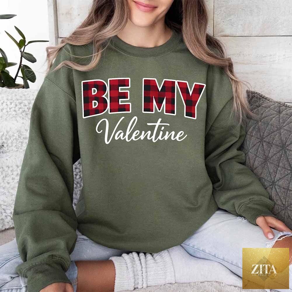 Adorb Custom Tees Be My Valentine buffalo plaid crewneck sweatshirt in green with Valentine’s Day design and cozy crewneck fit.