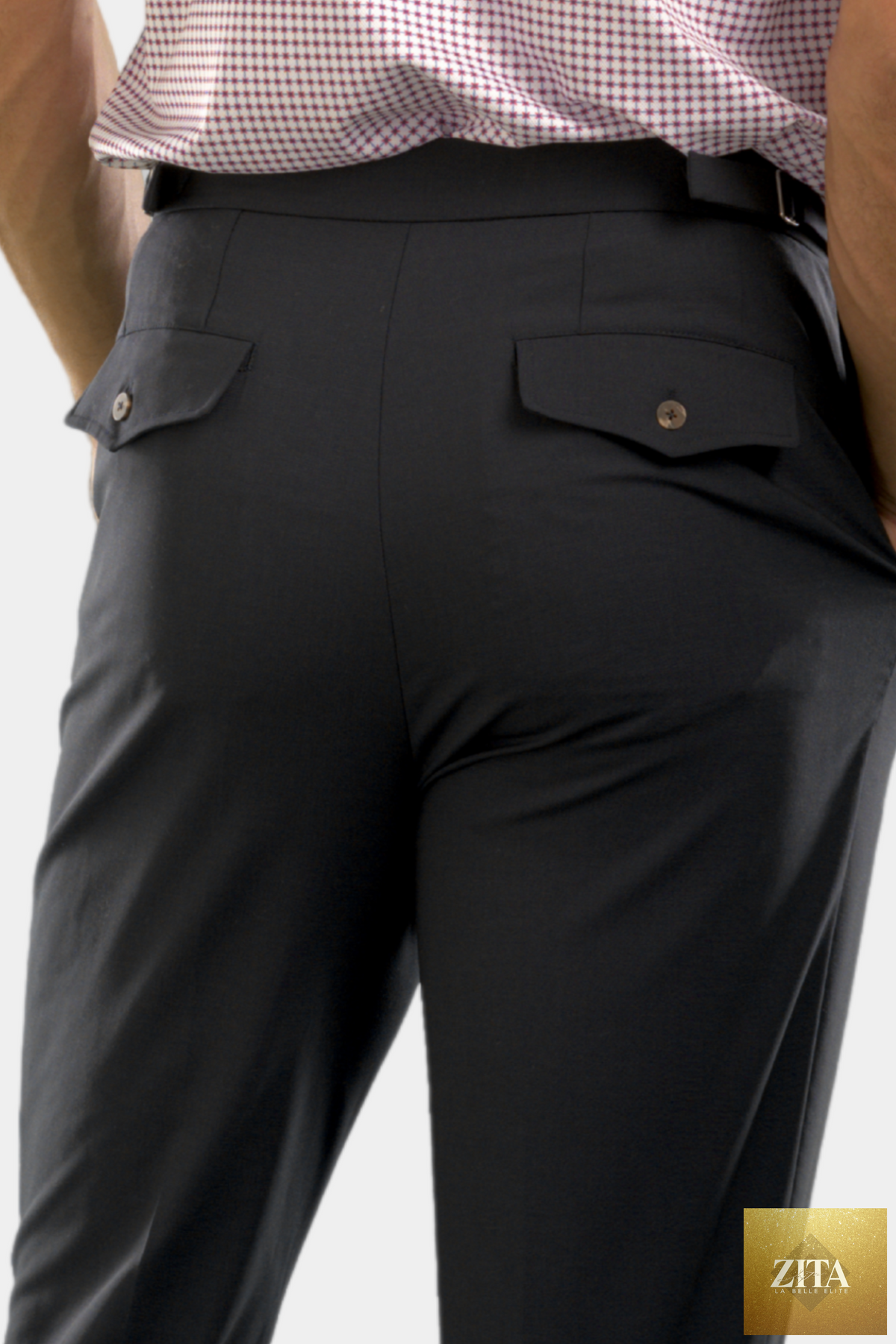 Navy Buki pleated wool trouser pants with a tailored fit and side pockets, displayed on a neutral background.