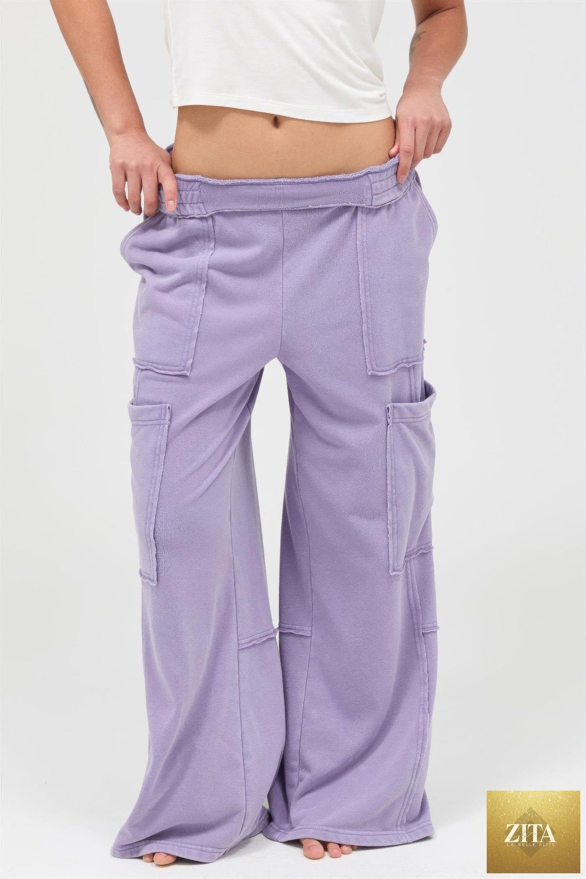 Mineral wash wide leg cargo pants from Tigbul's Variety Fashion Shop, featuring multiple pockets and relaxed fit.