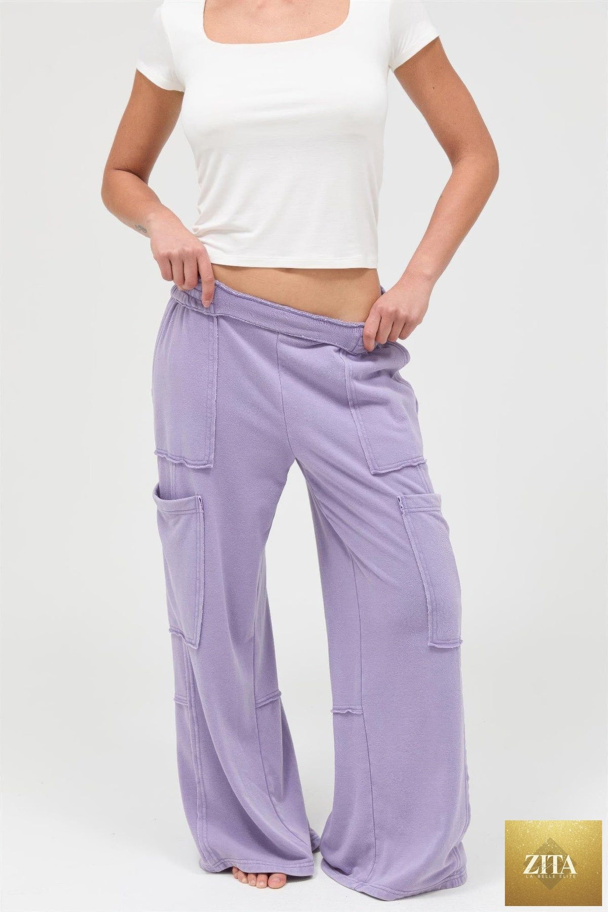 Mineral wash wide-leg cargo pants from Tigbul's Variety Fashion Shop, featuring multiple pockets and a relaxed fit.
