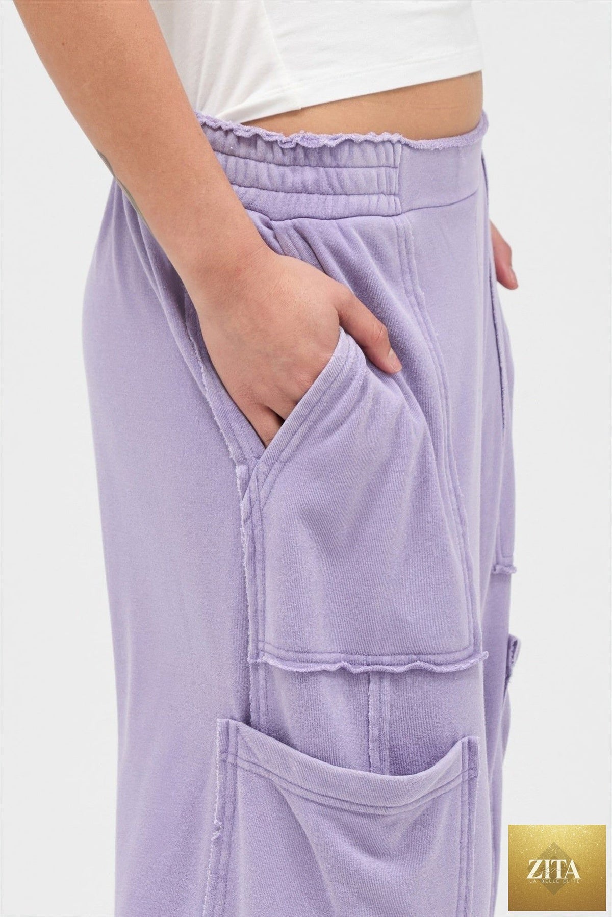 Mineral wash wide leg cargo pants in a light blue color, featuring multiple pockets and relaxed fit, by Tigbul's Variety Fashion Shop.