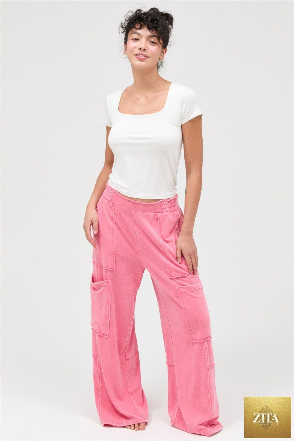 Mineral wash wide leg cargo pants in beige from Tigbul's Variety Fashion Shop, featuring multiple pockets and relaxed fit.