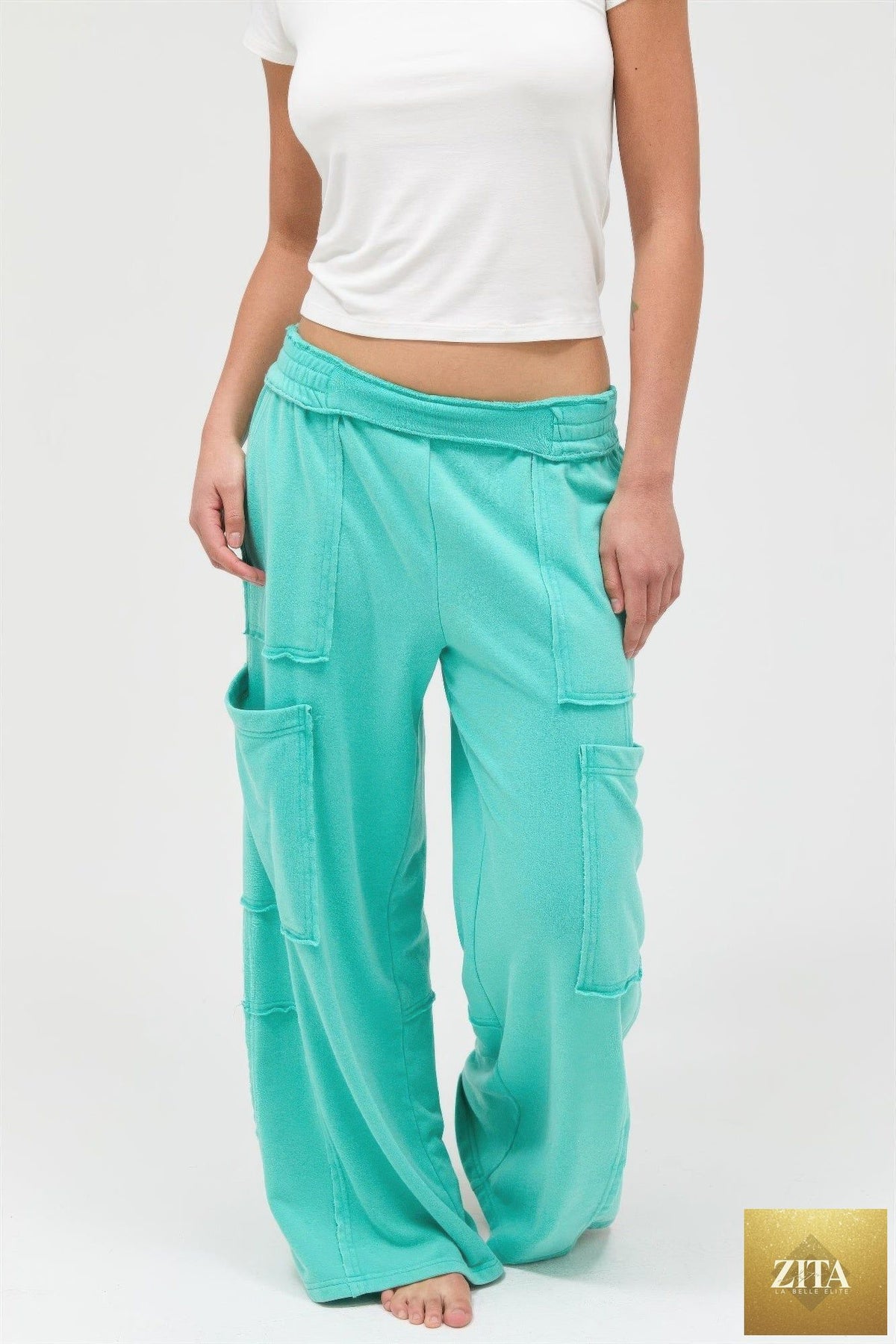 Mineral wash wide leg cargo pants by Tigbul's Variety Fashion Shop, featuring multiple pockets and relaxed fit.