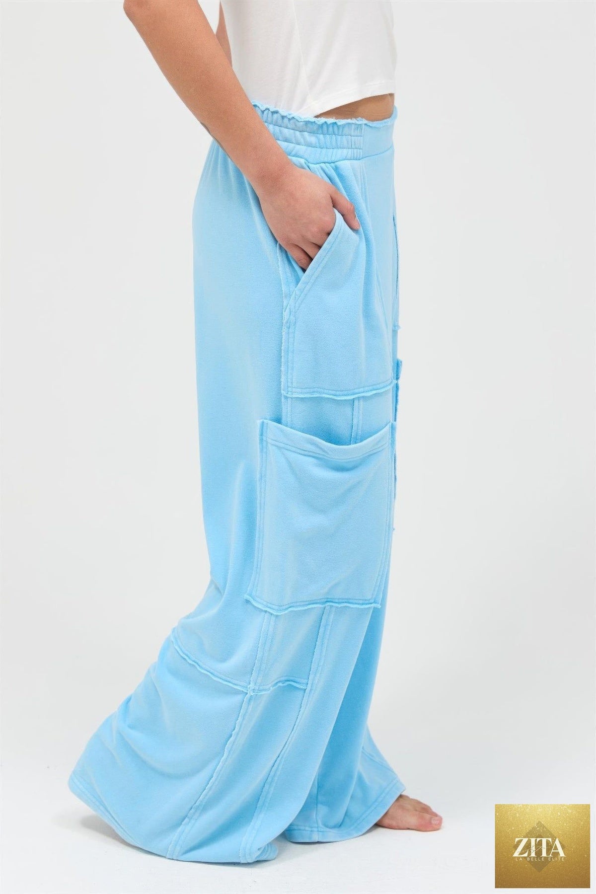 Mineral wash wide leg cargo pants in neutral tones, featuring multiple pockets and relaxed fit from Tigbul's Variety Fashion Shop.