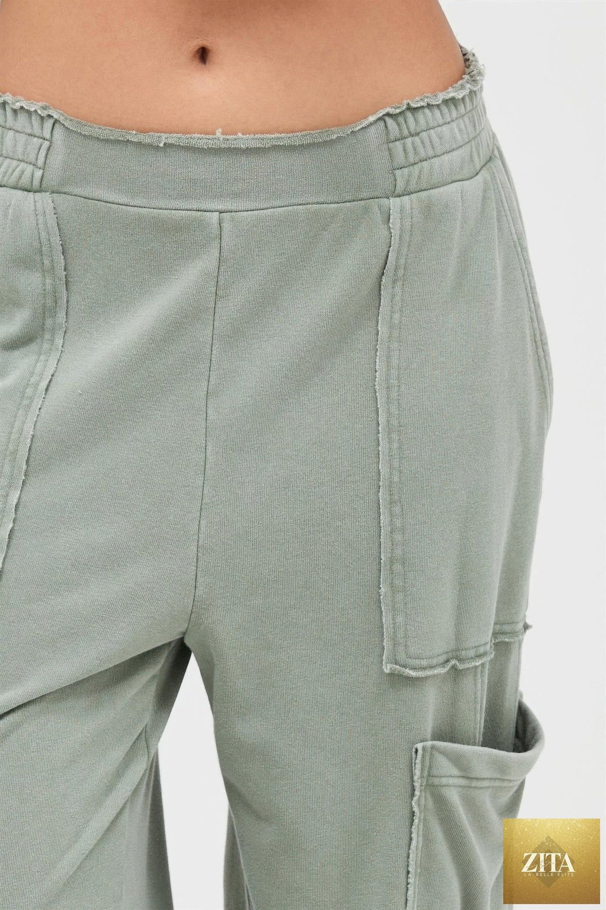Mineral wash wide-leg cargo pants from Tigbul's Variety Fashion Shop, featuring multiple pockets and a relaxed fit.