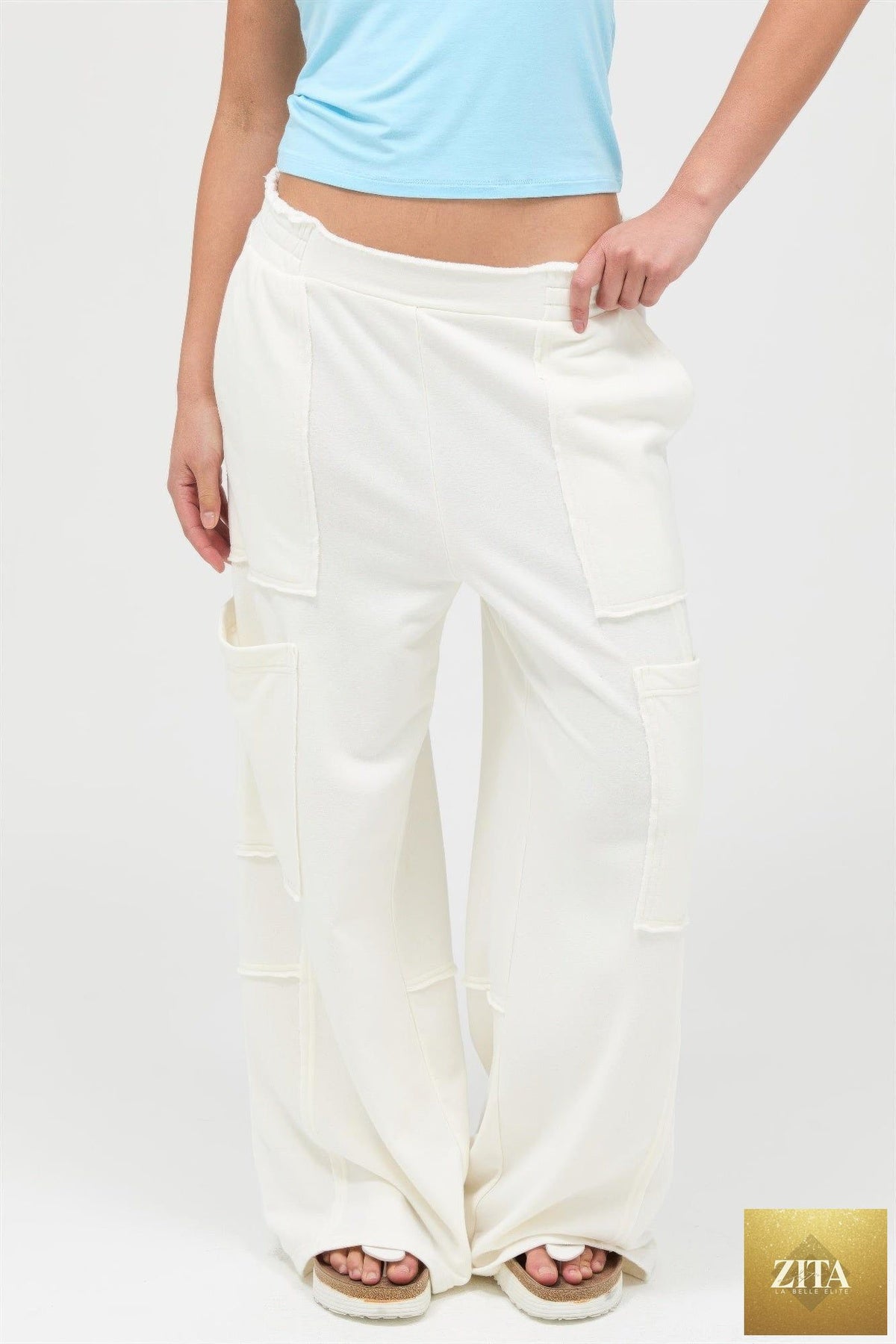 Mineral wash wide-leg cargo pants from Tigbul's Variety Fashion Shop, showing the relaxed fit and multiple utility pockets.