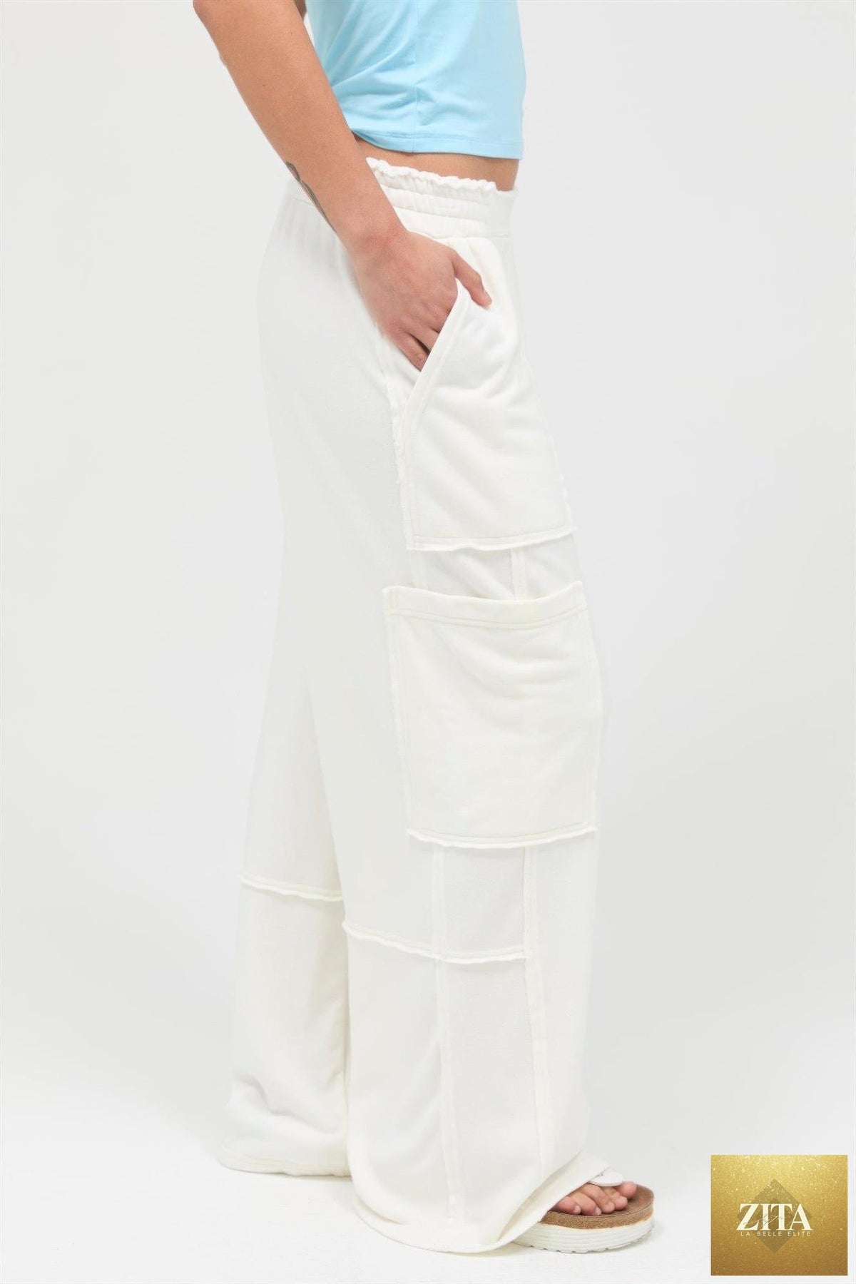 Mineral wash wide leg cargo pants from Tigbul's Variety Fashion Shop, featuring multiple pockets and relaxed fit.