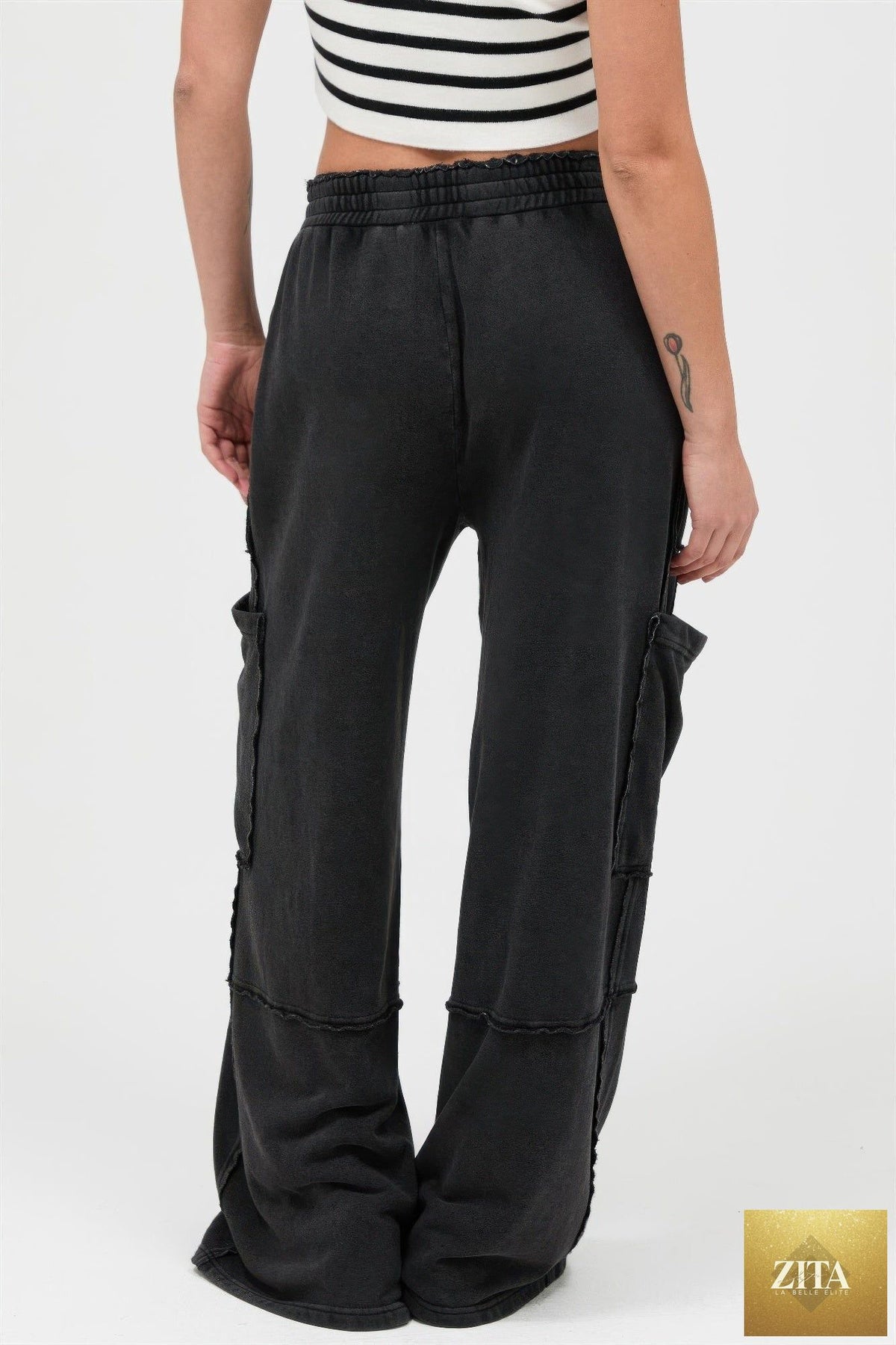 Mineral wash wide leg cargo pants by Tigbul's Variety Fashion Shop, featuring multiple pockets and relaxed fit.